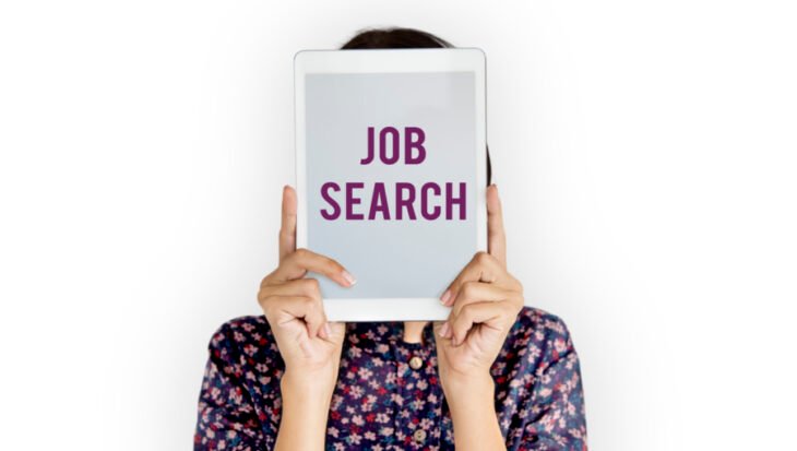 Woman holding a Job search poster